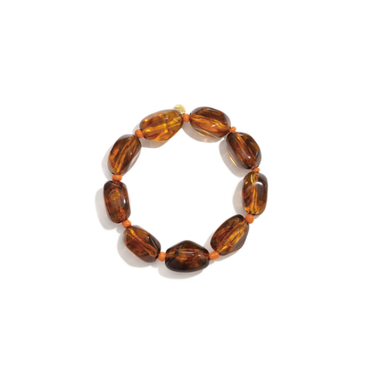 Bruine chunky marble kralenarmband met grote ovaalvormige kralen en oranje tussenkralen