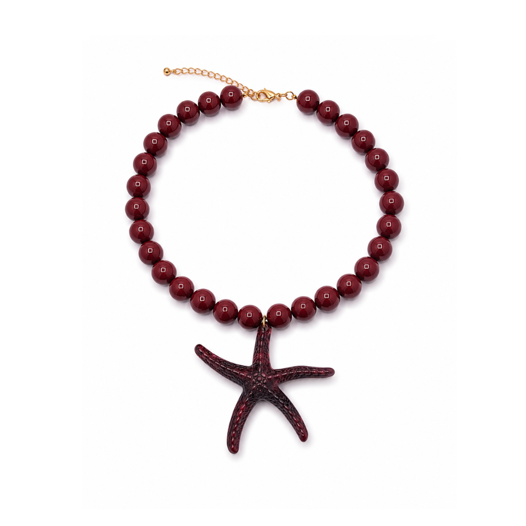 Bruine kralenketting Iris met 13,5 mm marble kralen en een oversized zeester bedel van 9 cm.