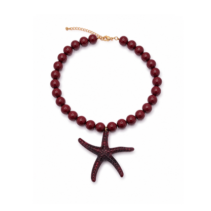 Bruine kralenketting Iris met 13,5 mm marble kralen en een oversized zeester bedel van 9 cm.