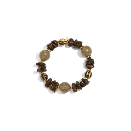 Donkerbruine chunky kralenarmband met glitterkralen, gestreepte kralen en gouden details