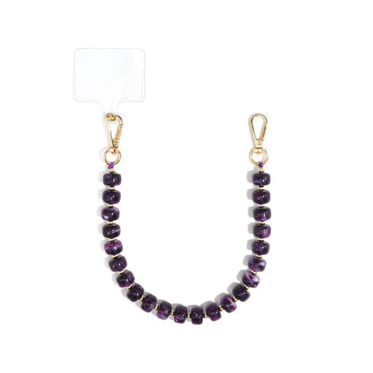 Donkerpaars chunky kralen telefoonkoord Faye met glanzende aubergine paarse marble kralen, gouden tussenkraaltjes en twee goudkleurige karabijnsluitingen