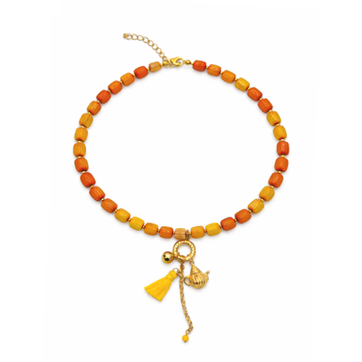 Geel oranje glazen kralenketting met kwast en theepot