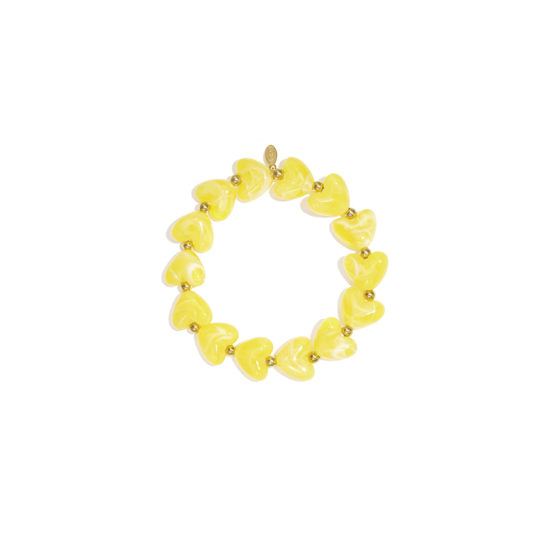 Gele hartjes kralenarmband met goudkleurige details in Ibiza style