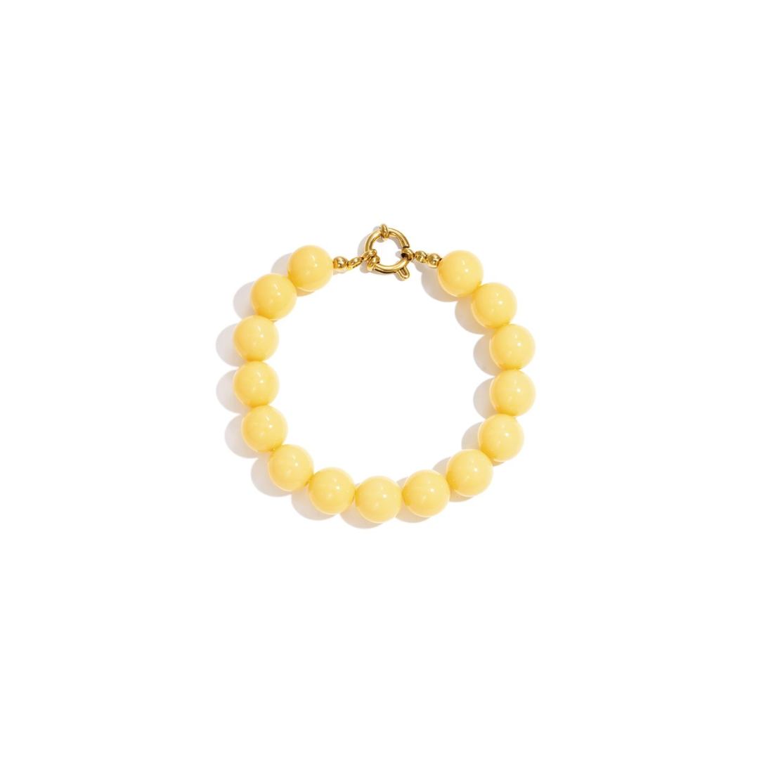 Gele kralenarmband met goudkleurig boeislot in Ibiza style