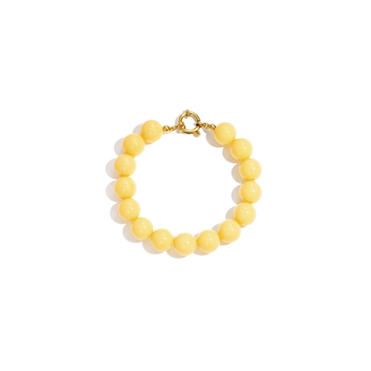 Gele kralenarmband met goudkleurig boeislot in Ibiza style