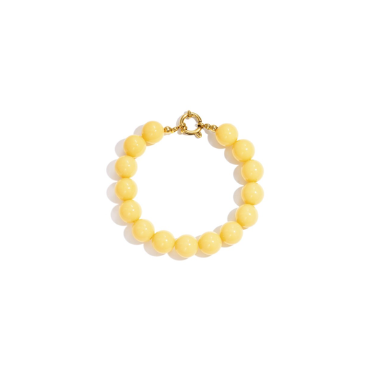 Gele kralenarmband met goudkleurig boeislot in Ibiza style
