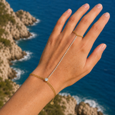 Gouden hand chain armband met ring tennisarmband