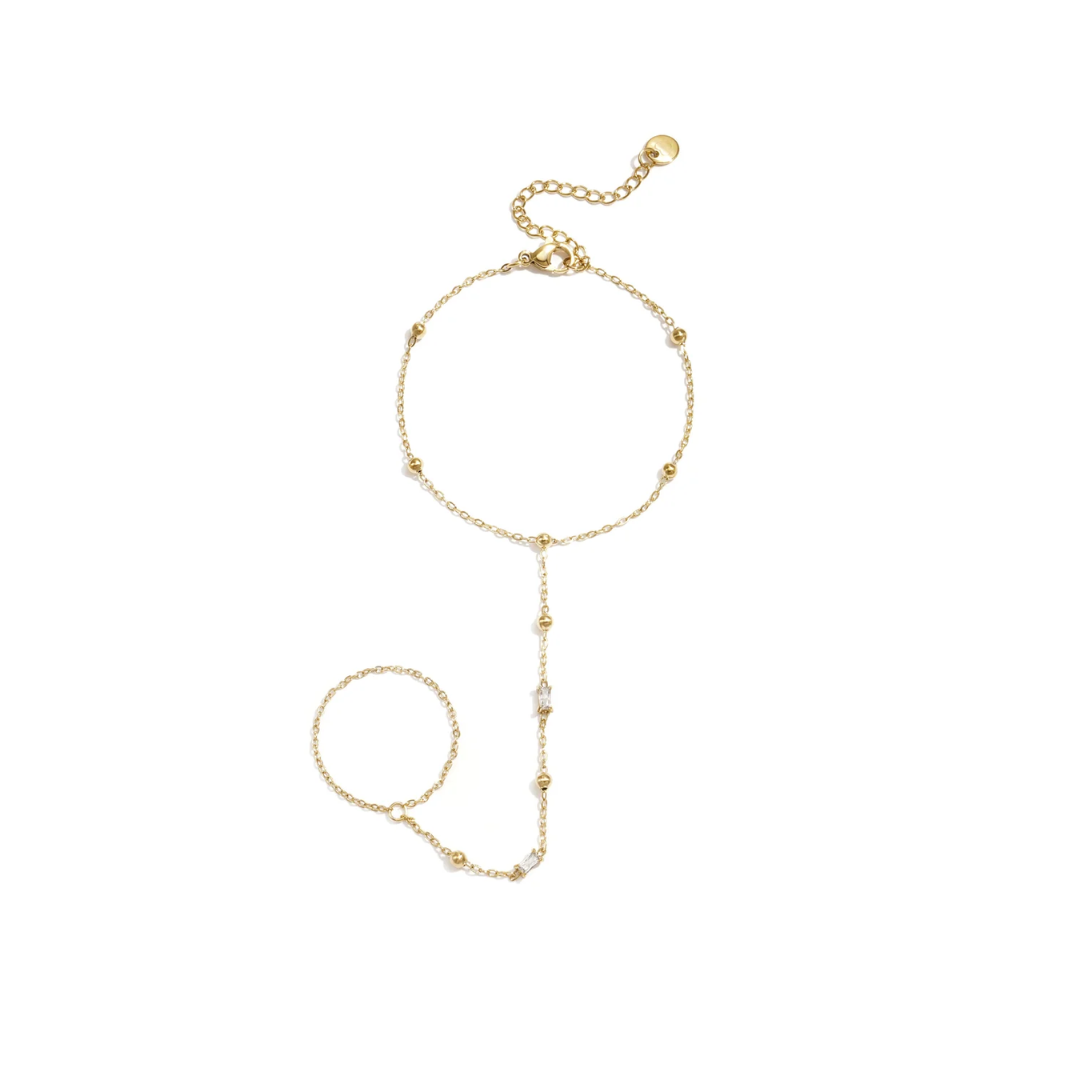 Gouden hand chain van stainless steel met bolletjes en subtiele strass steentjes.