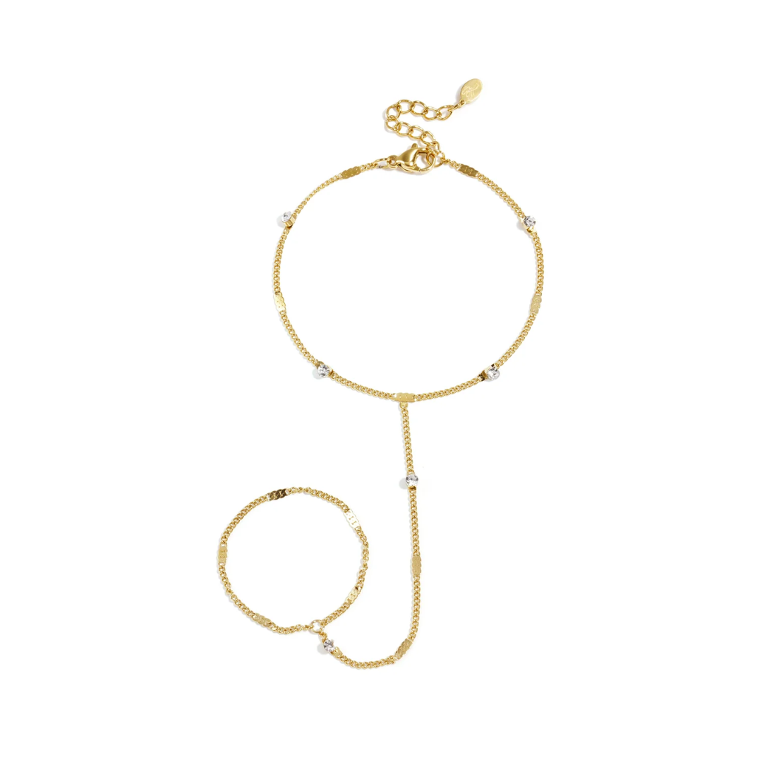 Gouden stainless steel hand chain met fijne schakelketting en kleine fonkelende strass steentjes van Casa Jadel.