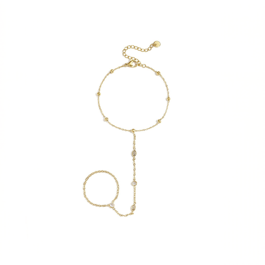 Gouden handchain armband met ring en ovale steentjes verbonden met fijne schakels