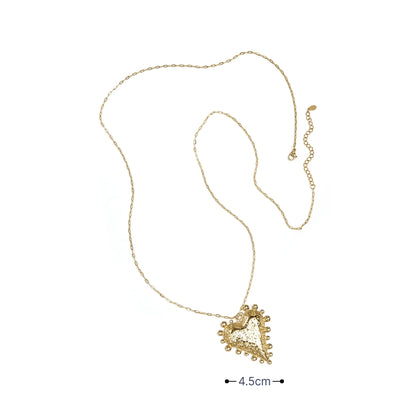 Gouden ketting met bolletjes hart hanger en organische structuur en afmeting
