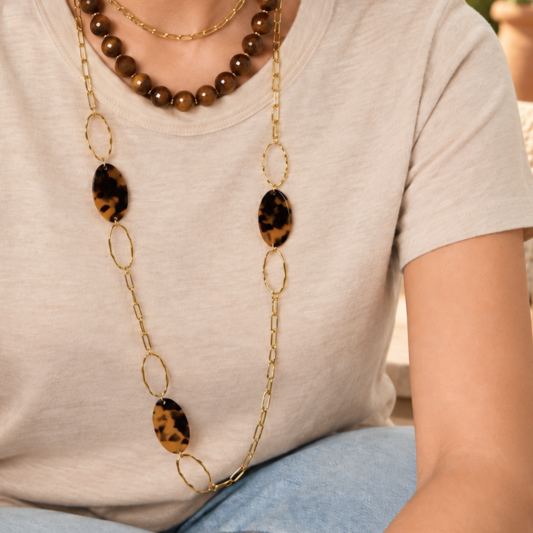 Gouden lange ketting met ovale panterprint schakels in bruin en zwart model