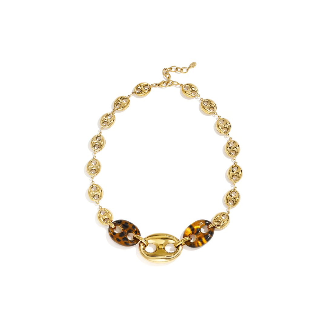 Gouden statement ketting met amber bruine panterprint bean - varkensneus schakels en grote gouden middenschakel