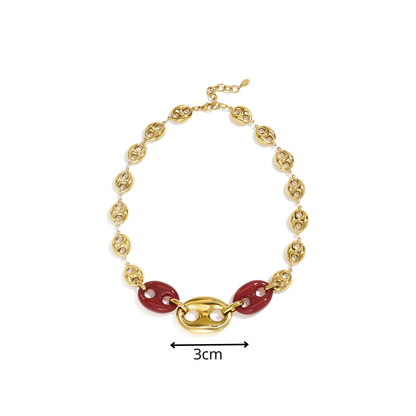 Gouden statement ketting met burgundy bean - varkensneus schakels en grote gouden midden schakel afmeting