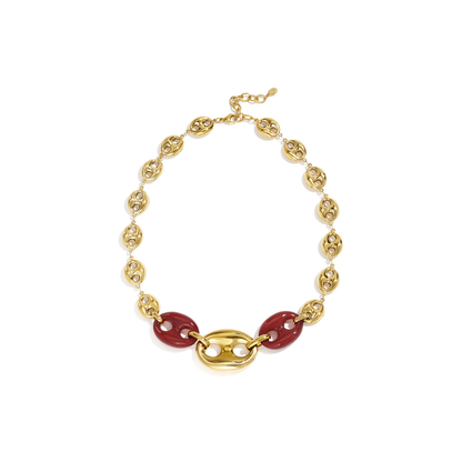Gouden statement ketting met burgundy bean - varkensneus schakels en grote gouden midden schakel