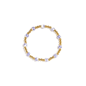 Gouden kralenarmband met wit-blauwe porseleinlook kralen van Casa Jadel.