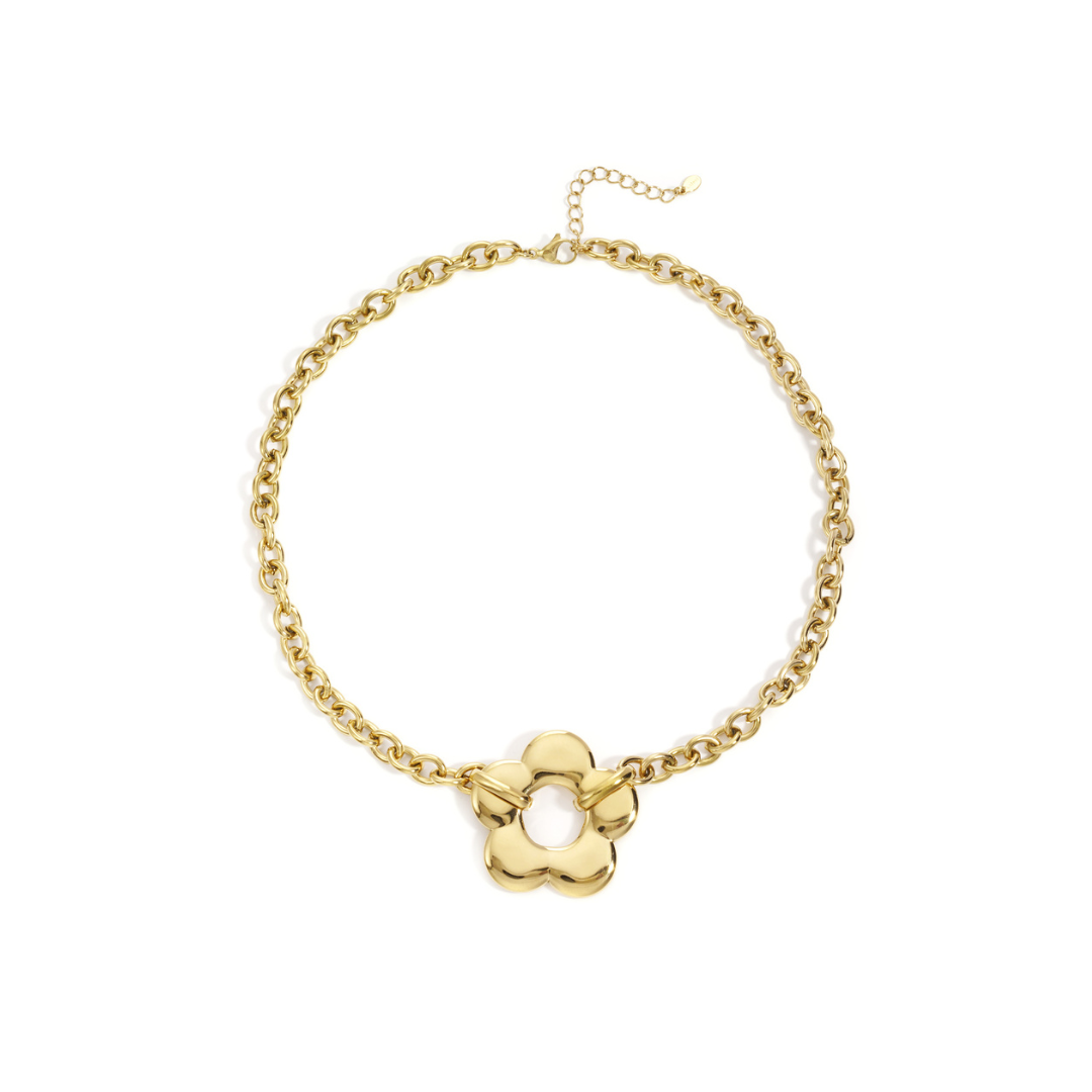 gouden schakelketting met statement bloem