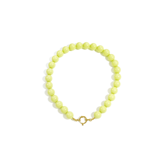 lichtgele grote kralen ketting met goudkleurig boeislot voor dames.