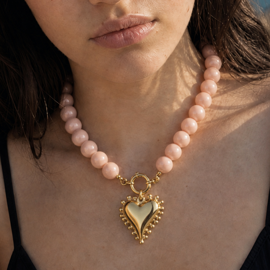Zalmroze kralenketting met statement hart