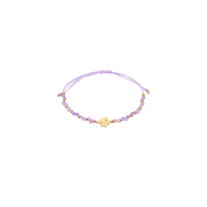 Lila touw armbandje met gouden klavertje, facetkralen en gouden details van Casa Jadel.