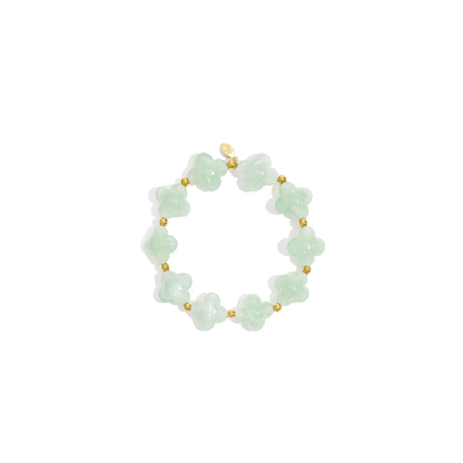 Mintgroene klaver armband met transparante kralen en gouden details van Casa Jadel