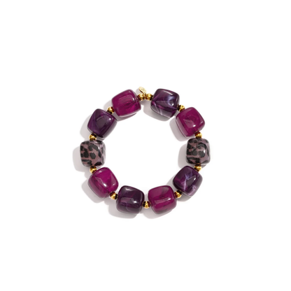 Mixed chunky kralenarmband met paarse, fuchsia en gevlekte resin kralen en goudkleurige accenten van Casa Jadel.
