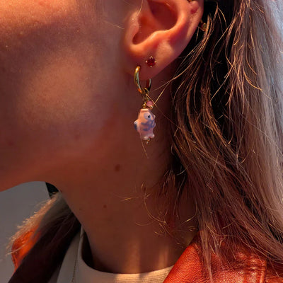 Gouden oorringetjes met roze vis kraaltjes en hartje