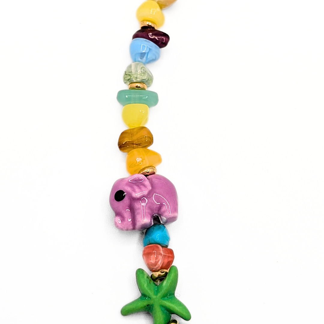 Statement kralenketting met pastelkralen en bedels