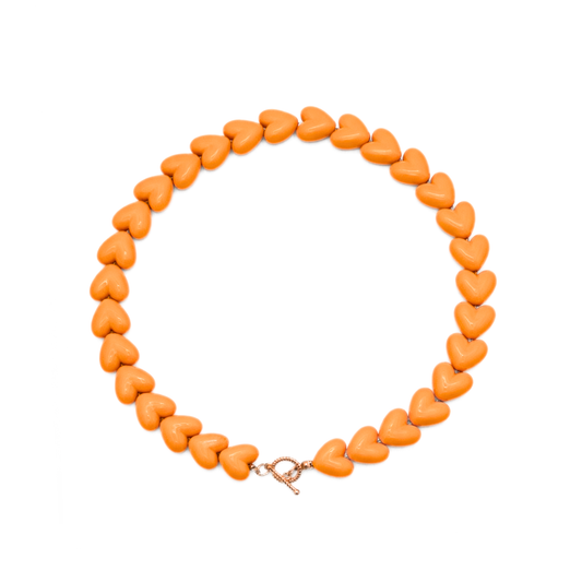 Oranje hartjes kralenketting met gouden frontsluiting Ibiza style dames ketting Casa Jadel