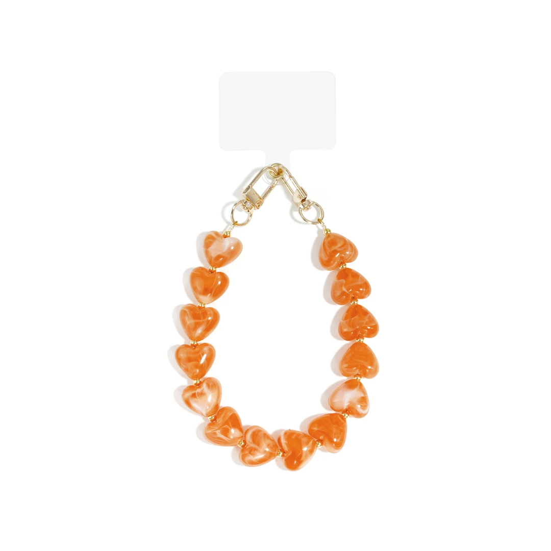 Oranje marble XL telefoonkoord met grote hartvormige kralen en goudkleurige sluitingen