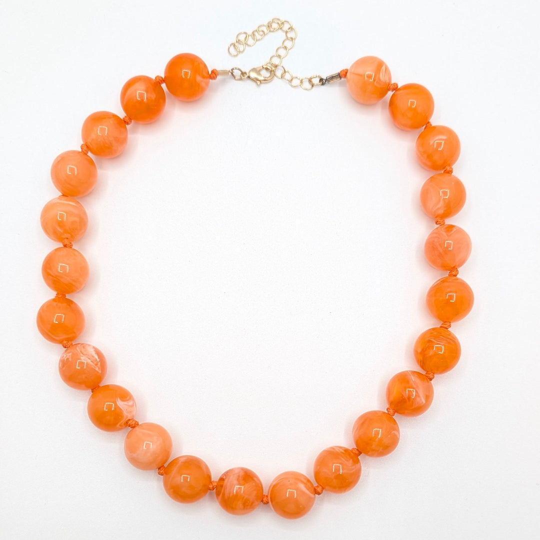 oranje gemarmerde grote kralenketting