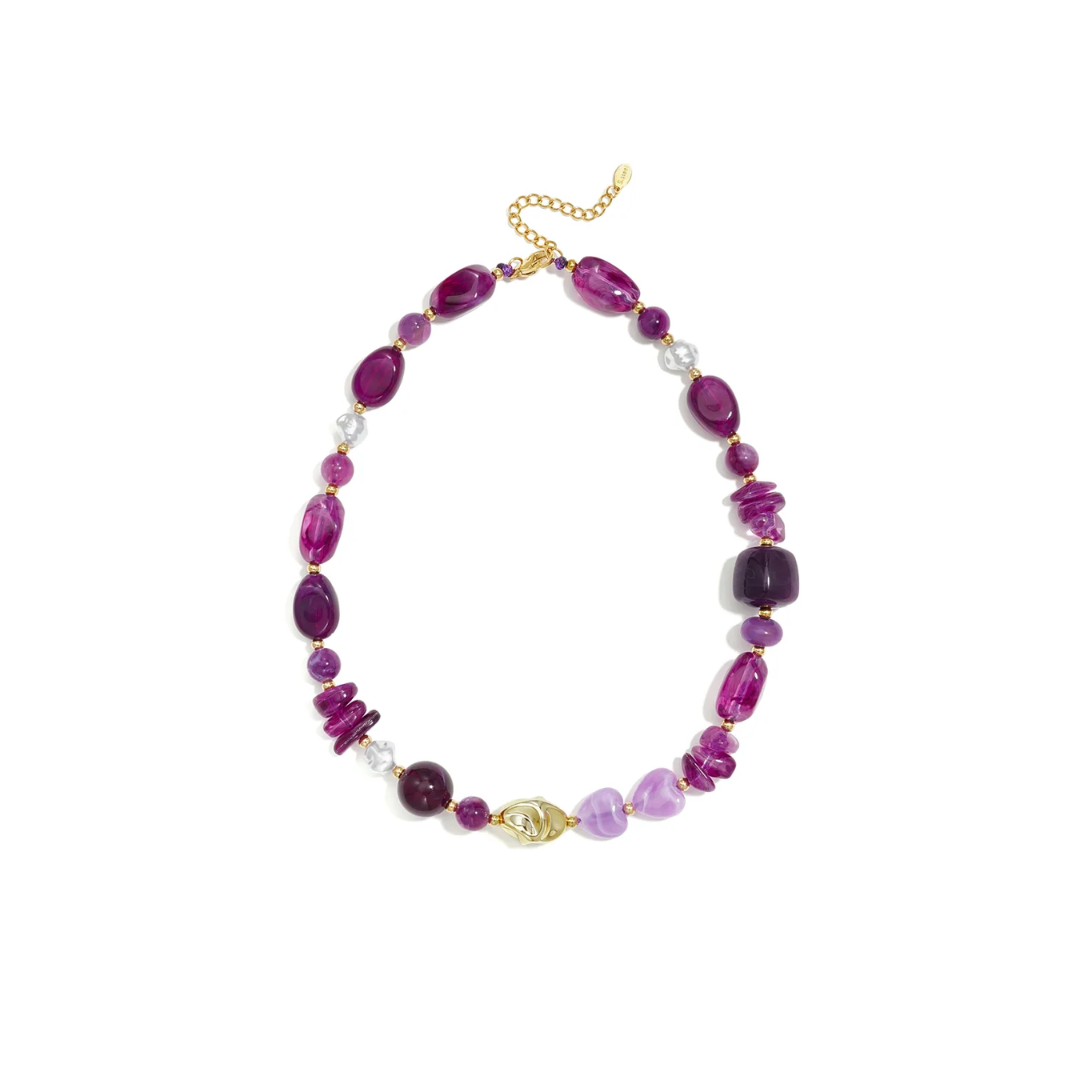 Paarse-lila mixed chunky kralenketting met verschillende kralen en gouden details