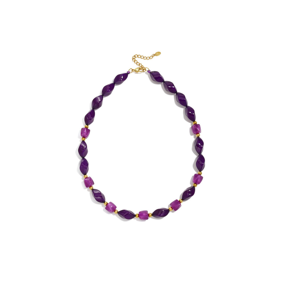 Paarse twisted kralenketting met fuchsia kralen en gouden details