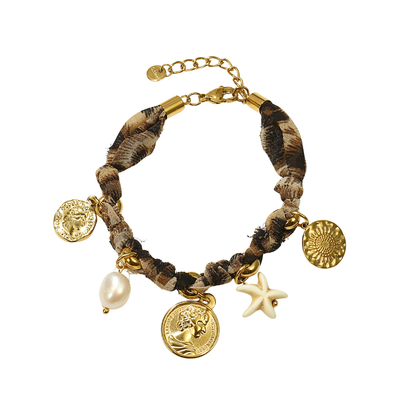 Panterprint bedelarmband met gouden munten en zeester