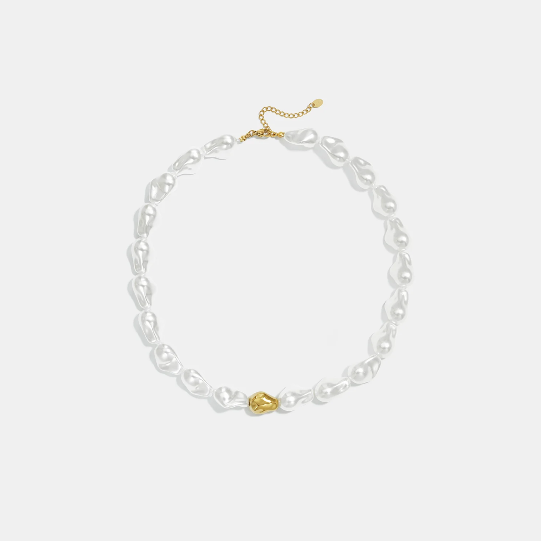 Witte parelmoer statement ketting met gouden kraal