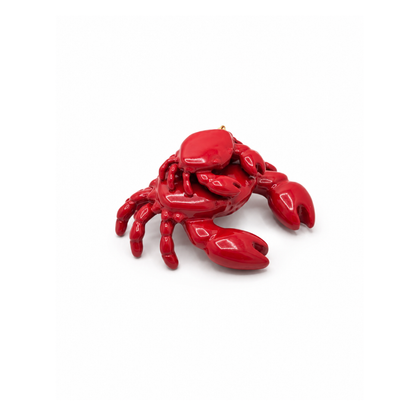 Rode 3D krab bedel in beide formaten opgestapeld.