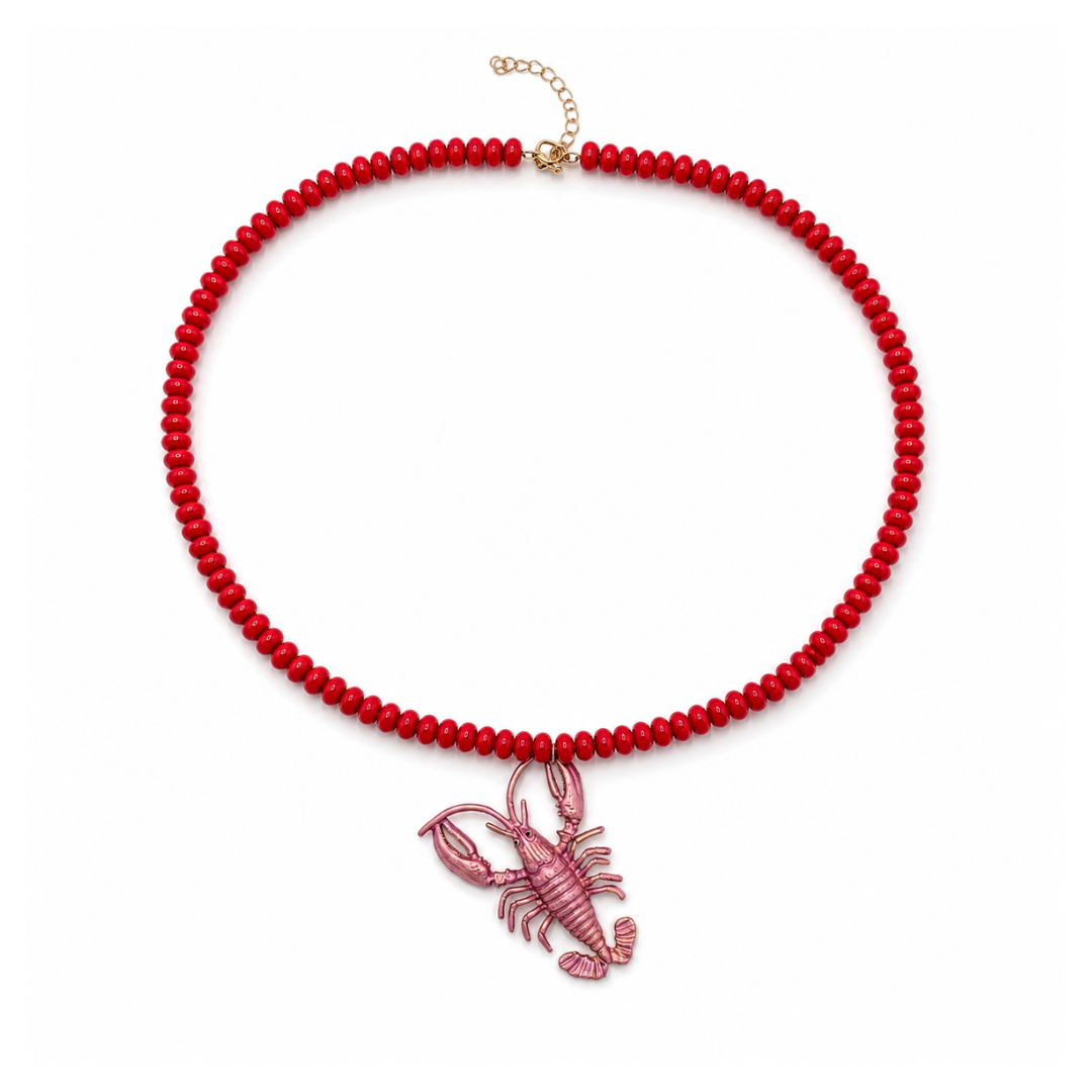 Rode lange kralenketting met roze metallic kreeft bedel van Casa Jadel