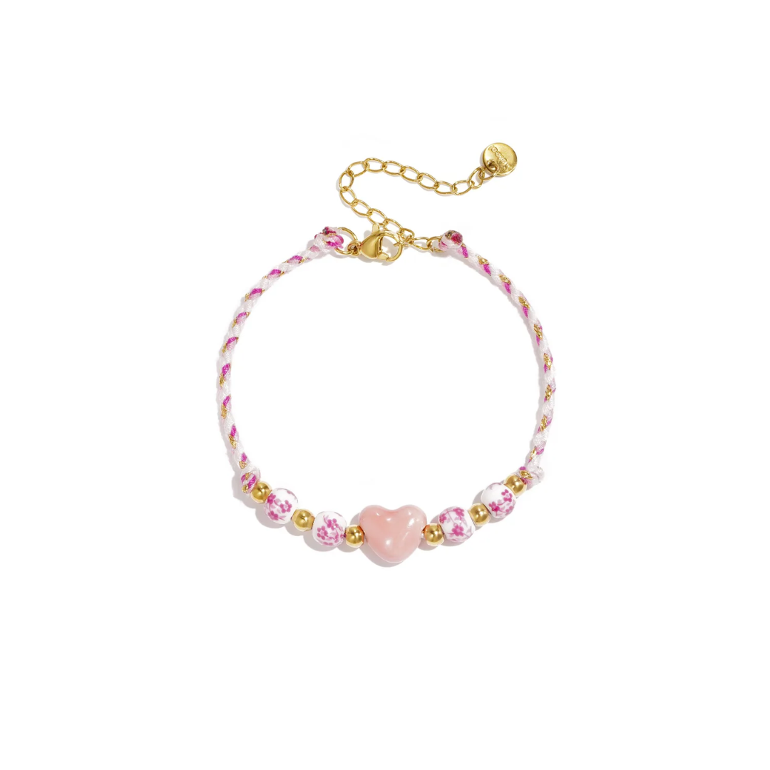 Roze wit touw armbandje met roze hartje en bloemenkralen