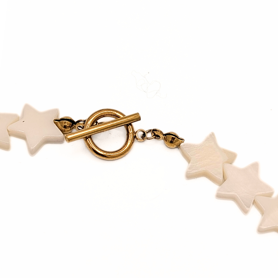 Goudkleurige toggle sluiting van sterren ketting
