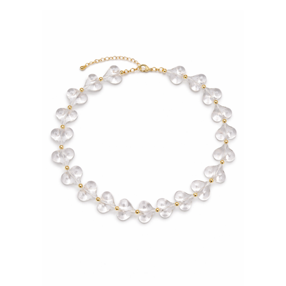 Transparante hartjes ketting met goudkleurige details en verlengketting.