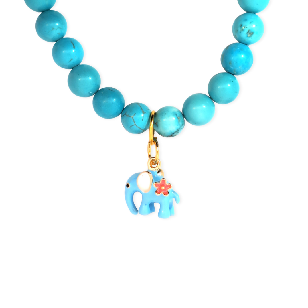Turquoise kralenketting met een blauwe olifant bedel, speels boho sieraad met zomerse uitstraling van Jadel.