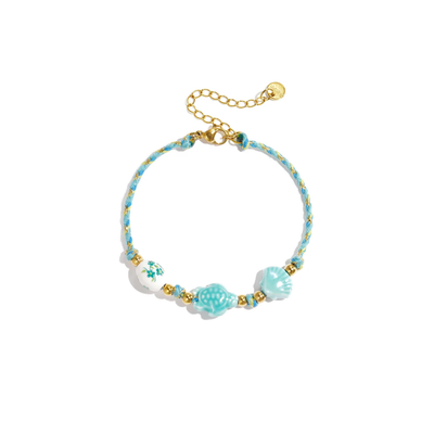 Turquoise touw armbandje schildpadje en schelpje