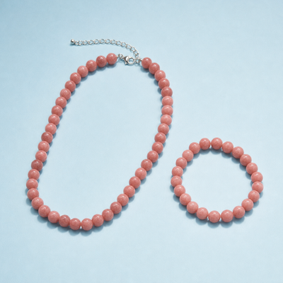 zonnesteen natuursteen kralenset met roze kralenketting en bijpassende armband